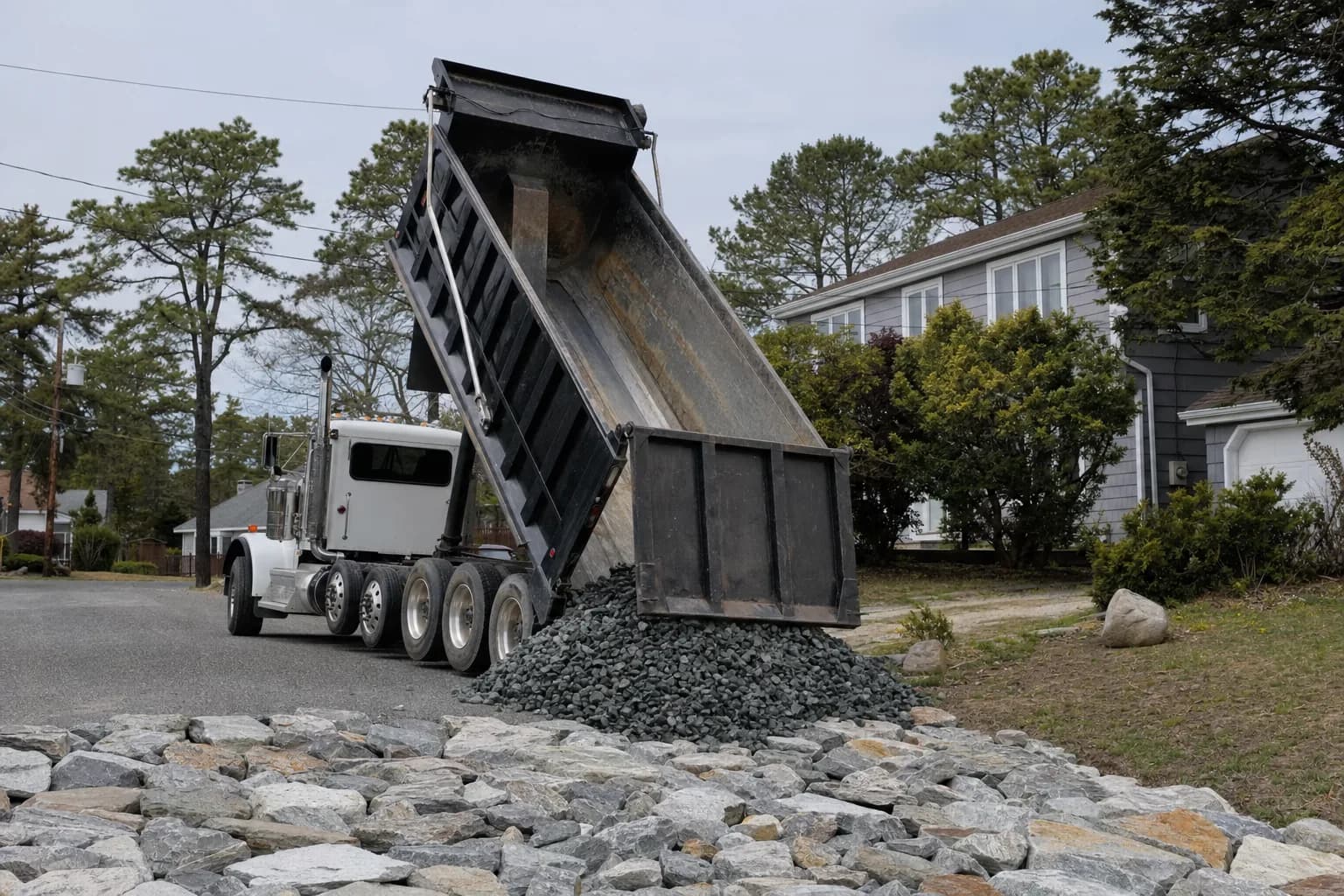 Dump truck delivering gravel